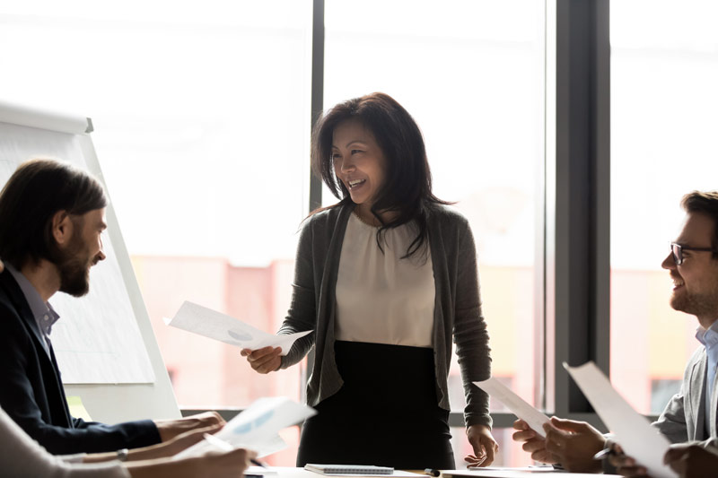 Achieva-level woman in a meeting